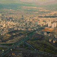 Aerial view of Tehran in a rainy day with ray of sunlight shining through clouds on the city. Photo taken on: March 13th, 2014 . © Borna Mirahmadian | Dreamstime 