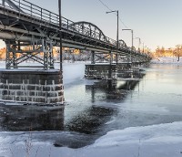 © Emmoth | Dreamstime.com - Bridge Over Frozen River In Umeå, Sweden 
