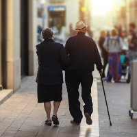Mature couple of lovers walking hand in hand © Daniel Myjones/shutterstock 