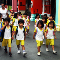 Group of children walking in singapore © Danilo Mongiello | Dreamstime.com 